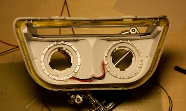 This is the disassembled tail light with the two LED rings mounted around the bulb holes.